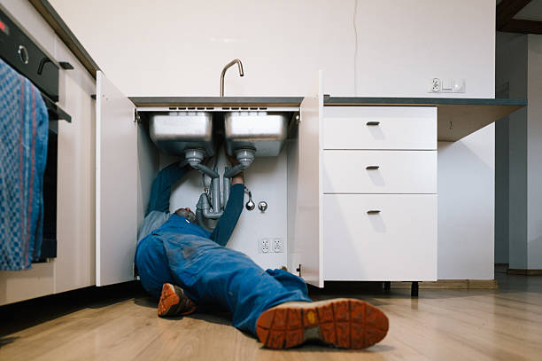 Professional Emergency Plumber technician working in Golden, IL